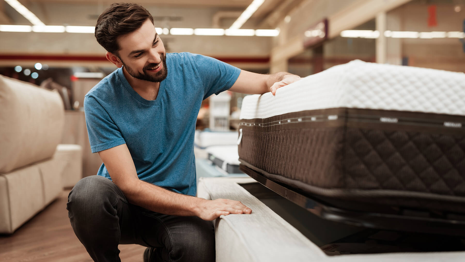 The man is testing mattress